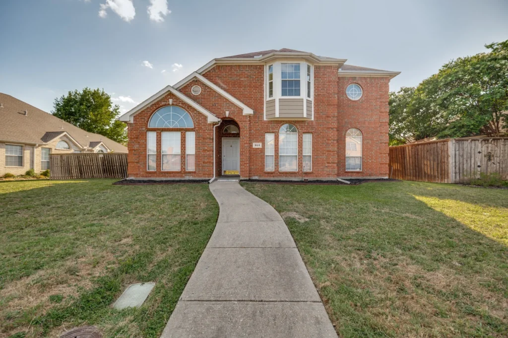 Exterior of the DeSoto rental home after the property turnaround.